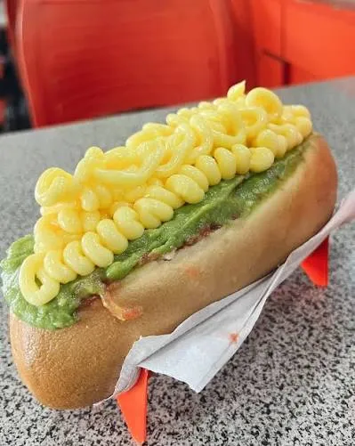Completo Mojado – hot dog topped with avocado and mayonnaise